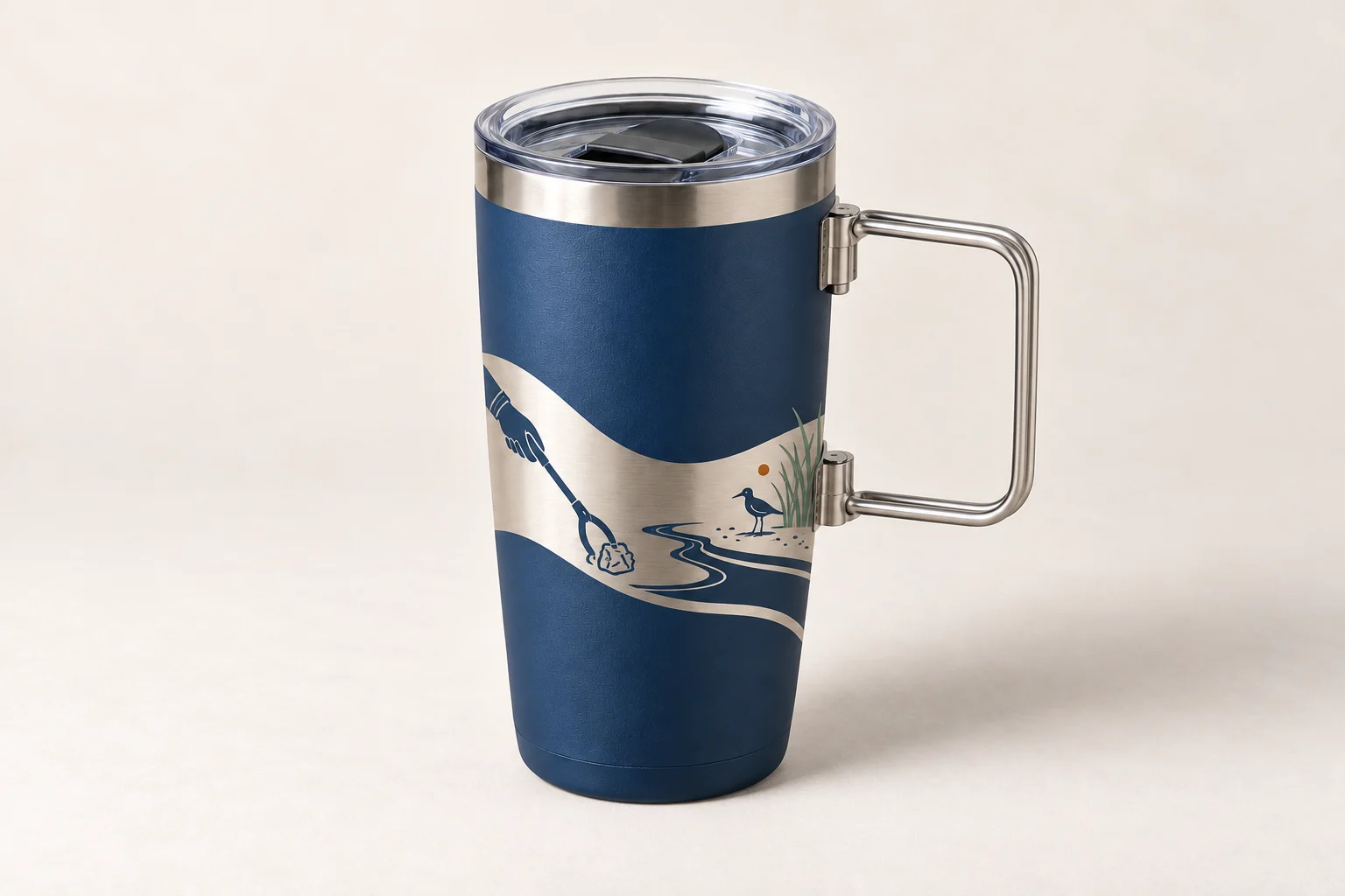 Blue steel tumbler with exposed-metal shoreline illustration and folding wire handle