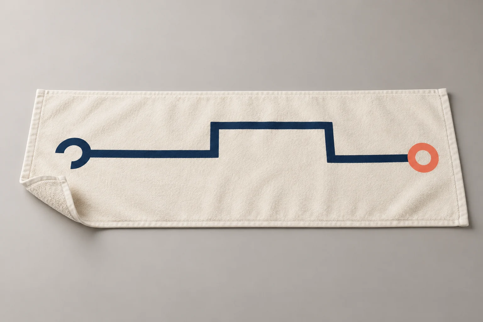 White sports towel with a navy route and coral finish ring