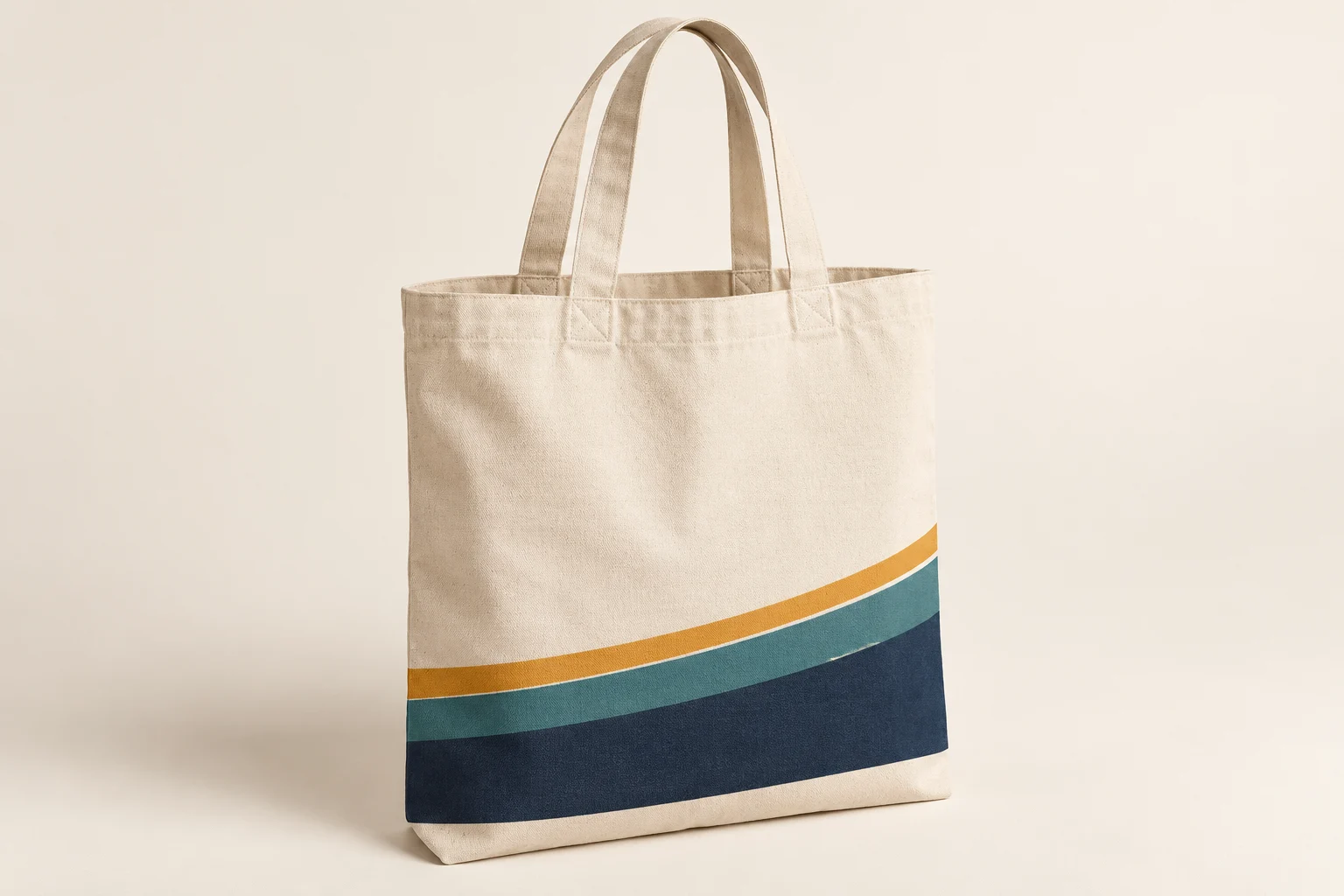 Warm-white canvas tote with three colored bands near the bottom