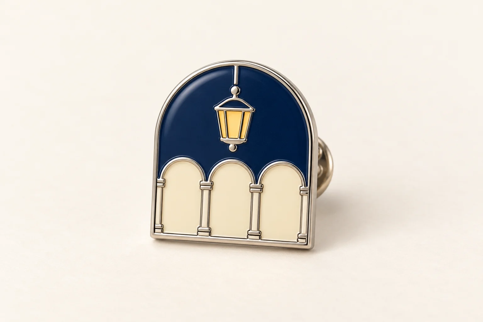 Small arch-shaped campus pin with three doorways and a lamp