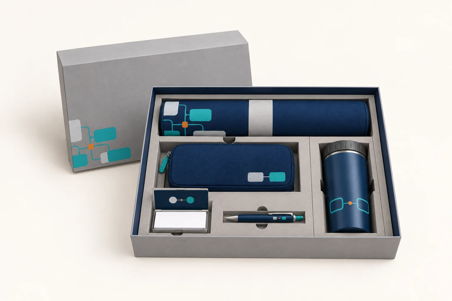 Open onboarding box with rolled desk mat and separate compartments for organizer, cup, pen and card case